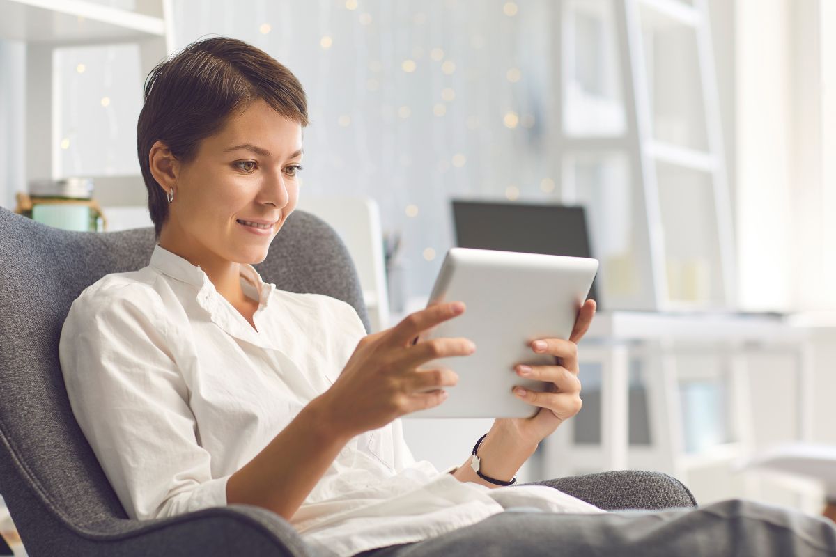 A picture of someone looking at their gadget. 