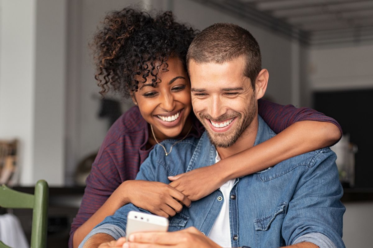 A picture of a couple smiling. 