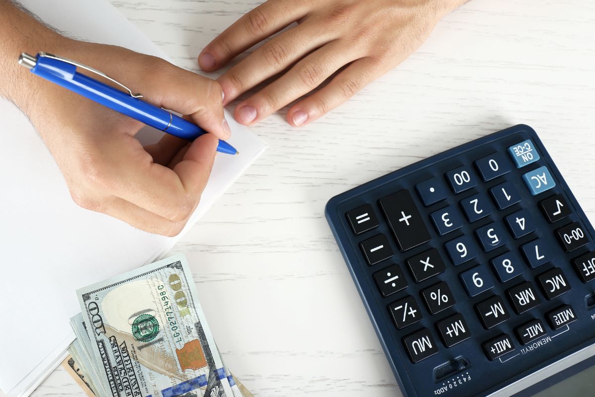 A picture of someone calculating something. 