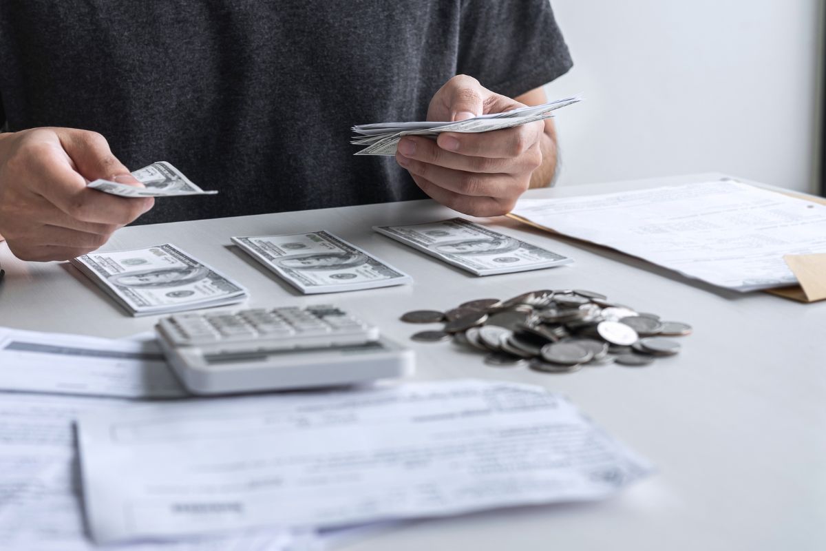 A picture of someone organizing their cash. 