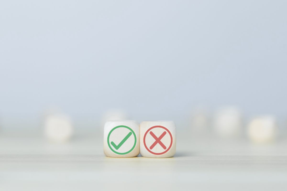 A picture of a check and a cross sign.