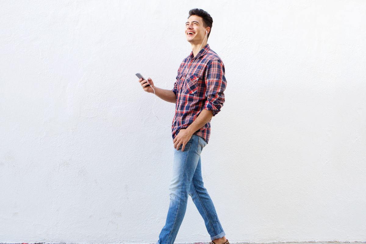 A picture of someone happily walking. 