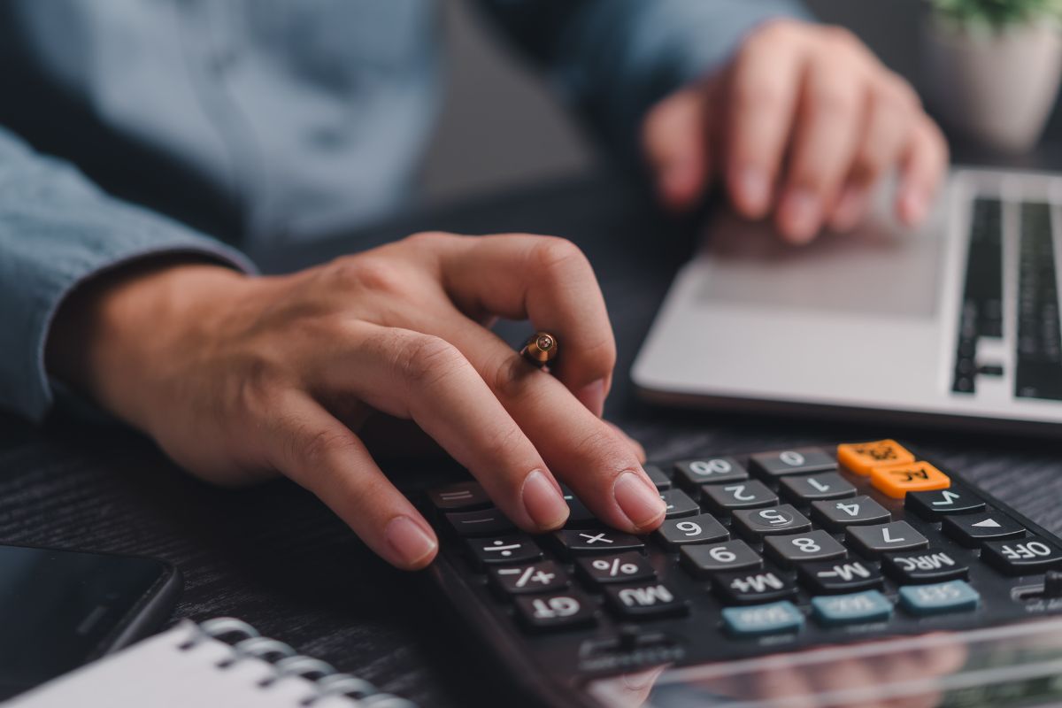 A picture of someone calculating something. 
