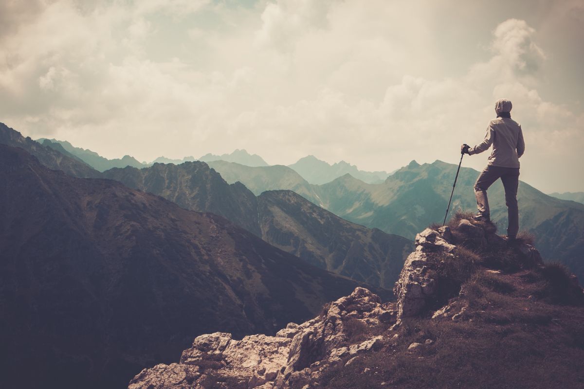A picture of someone climbing a mountain. 
