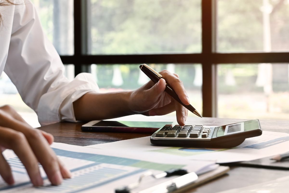 A picture of someone calculating something. 