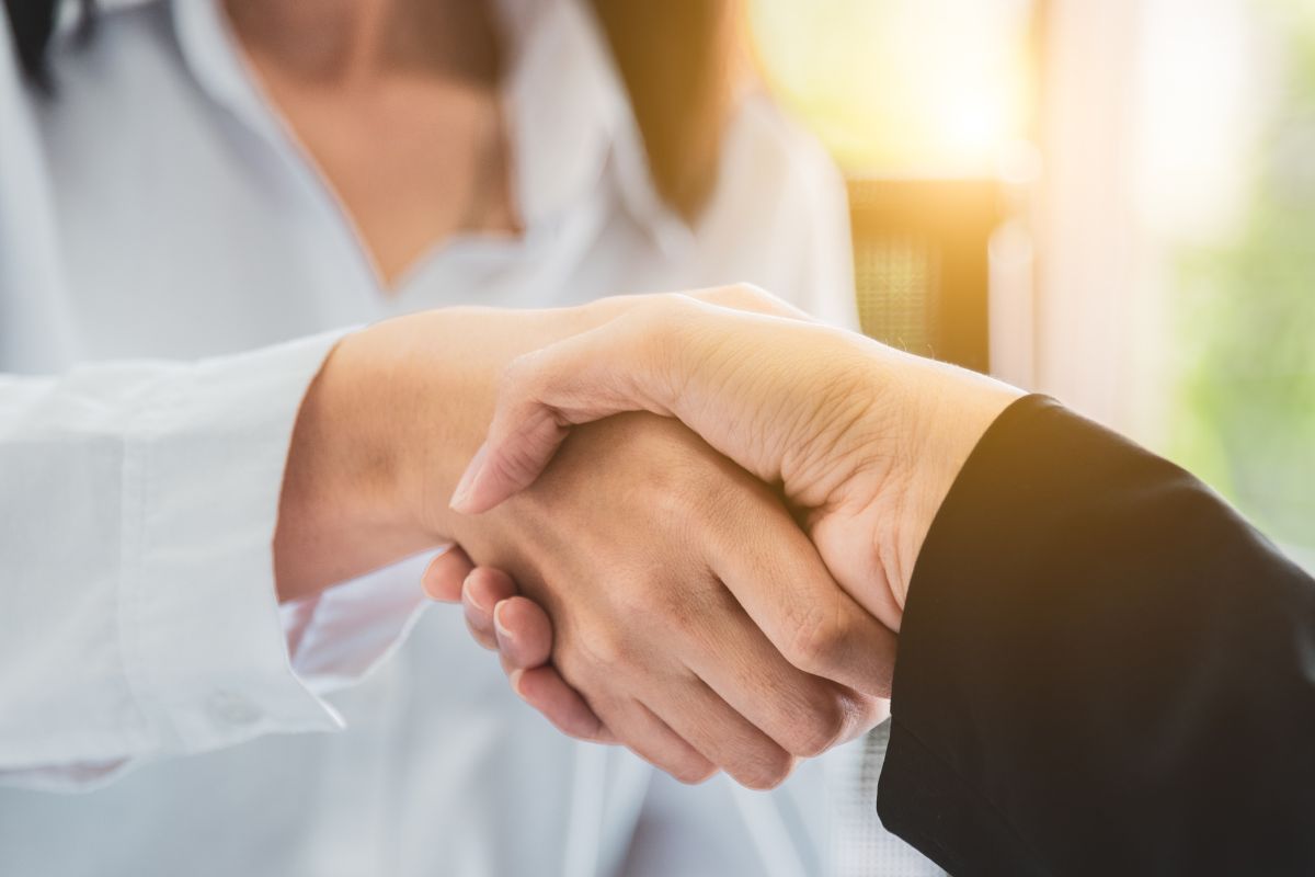 A picture of people shaking hands. 