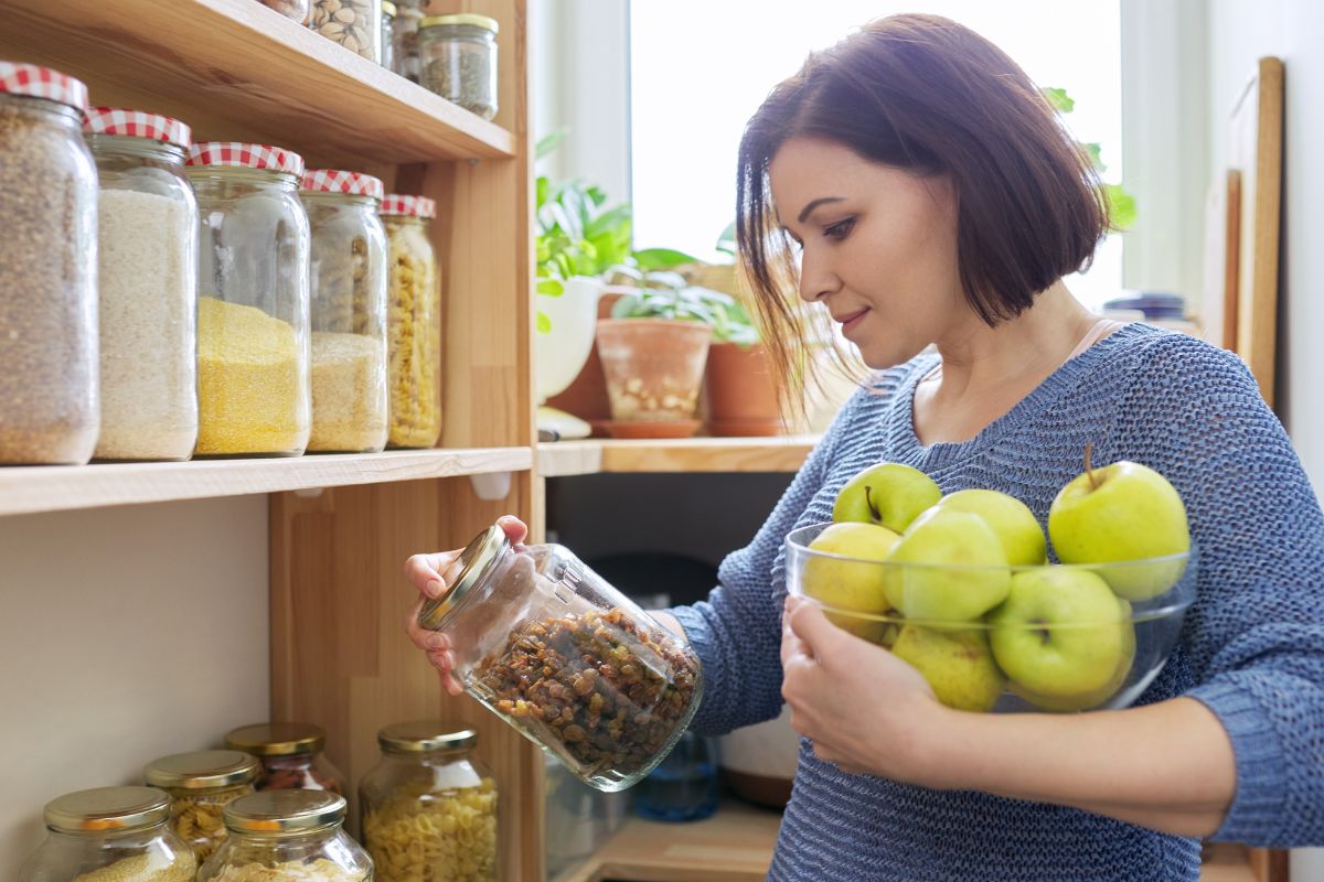 A picture of someone looking in their pantry.
