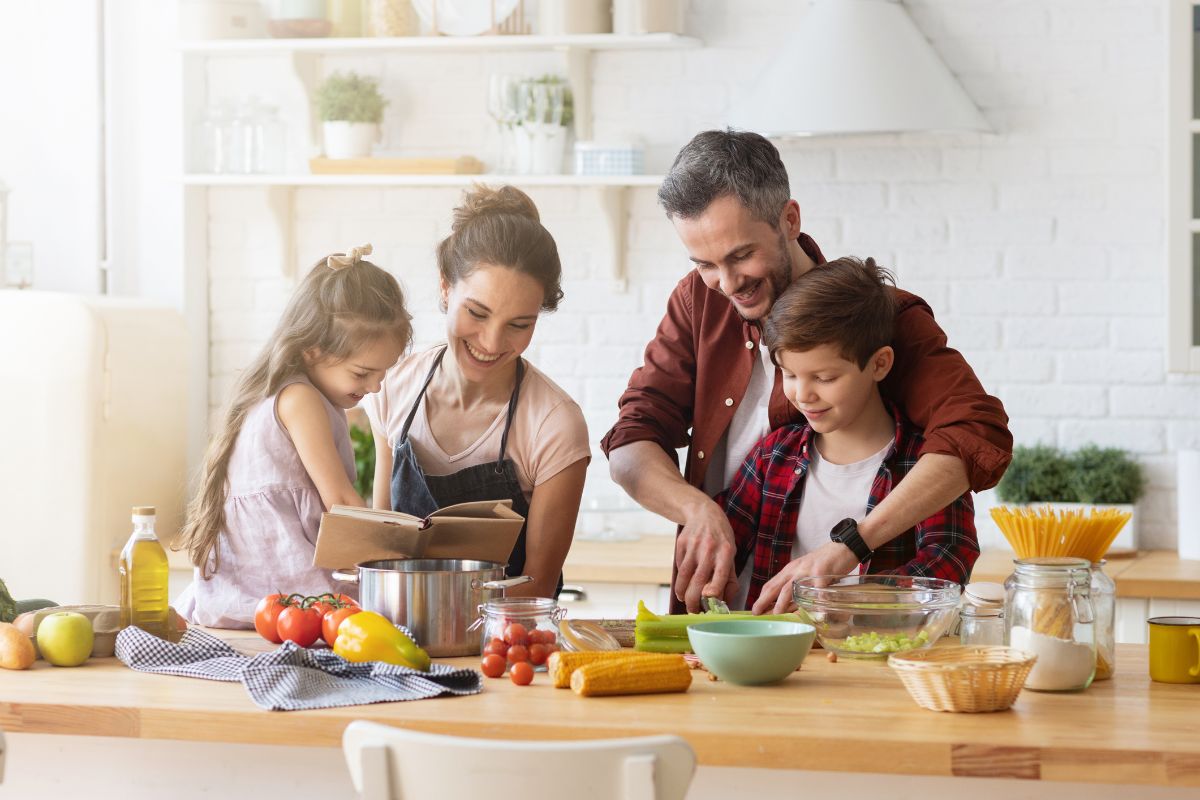 A picture of a family cooking. 