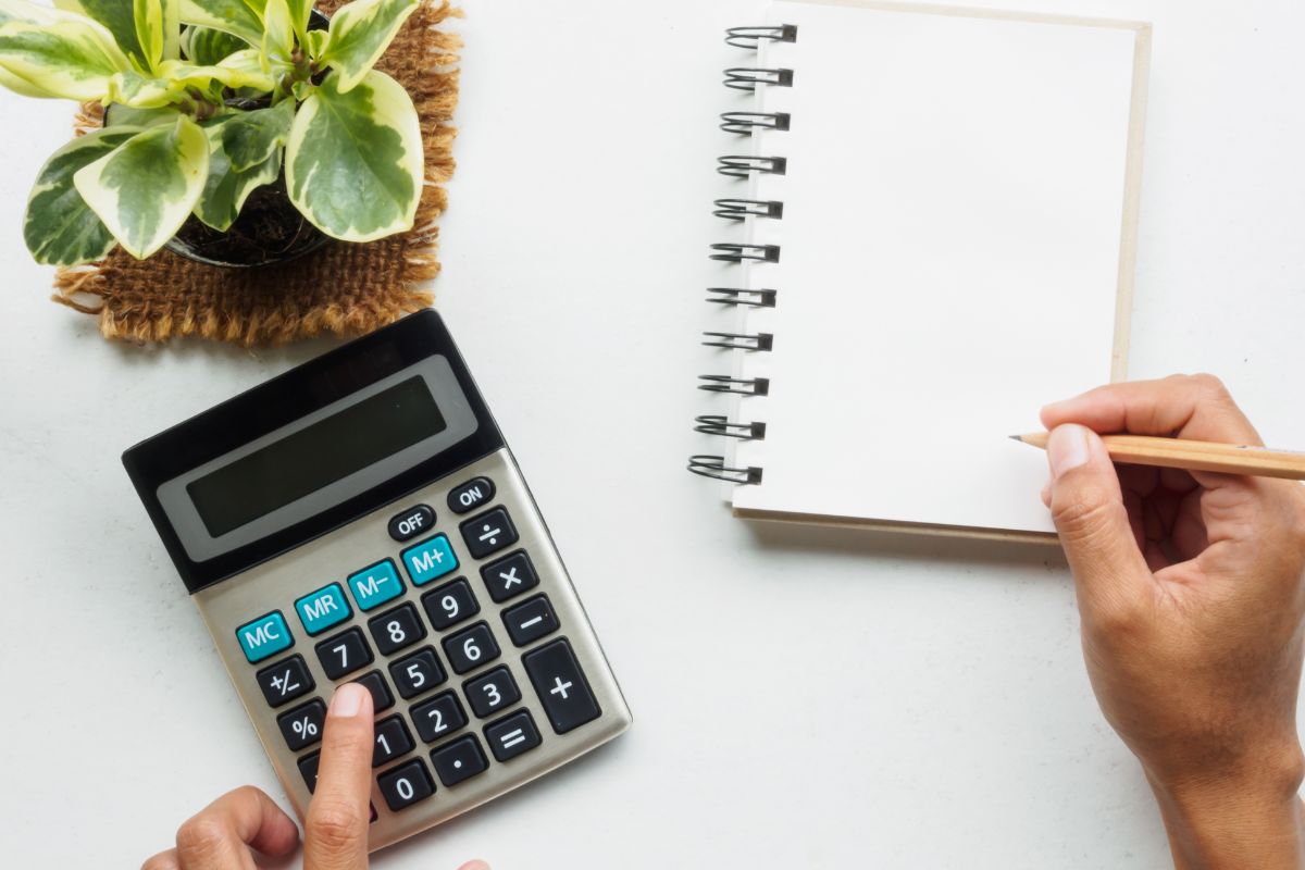 A picture of someone calculating something. 