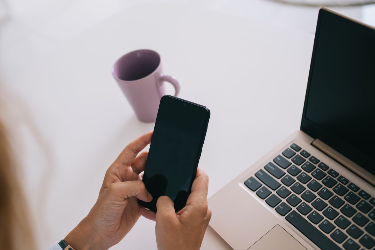 A picture of someone using their phone. 