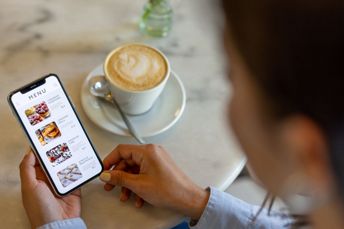 A picture of someone looking at the menu.