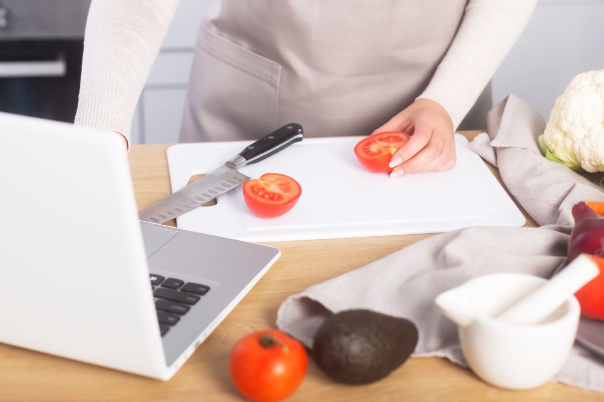 A picture of someone looking at the internet while cooking. 