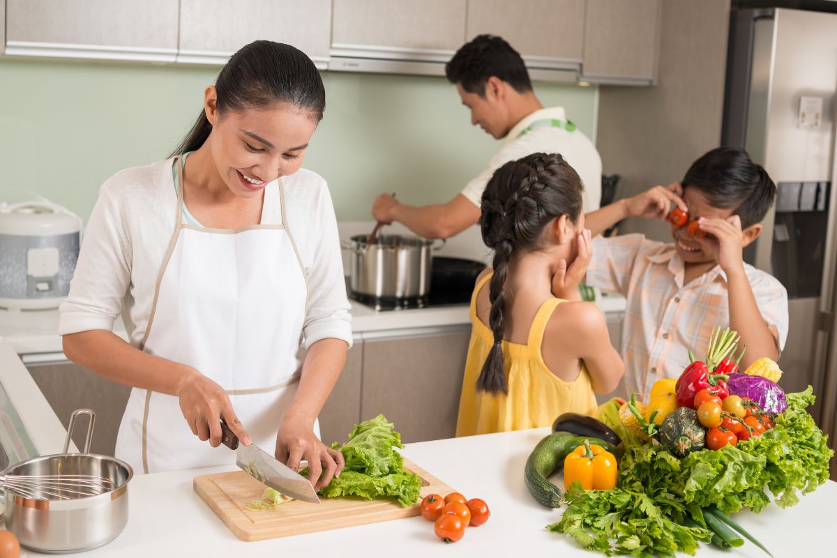 A picture of a family cooking. 