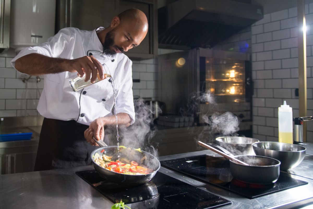 A picture of a chef cooking. 