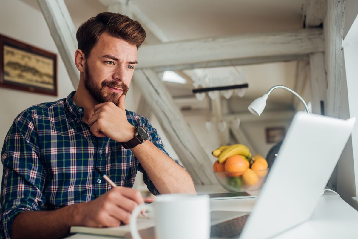 A picture of someone taking notes. 