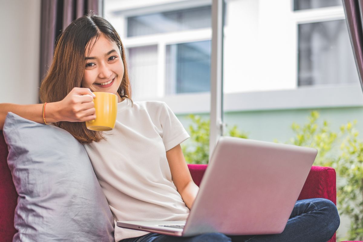 A picture of someone using a laptop. 