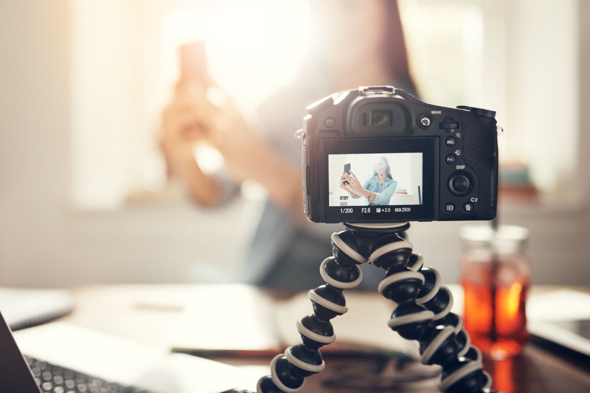A picture of someone recording themself. 