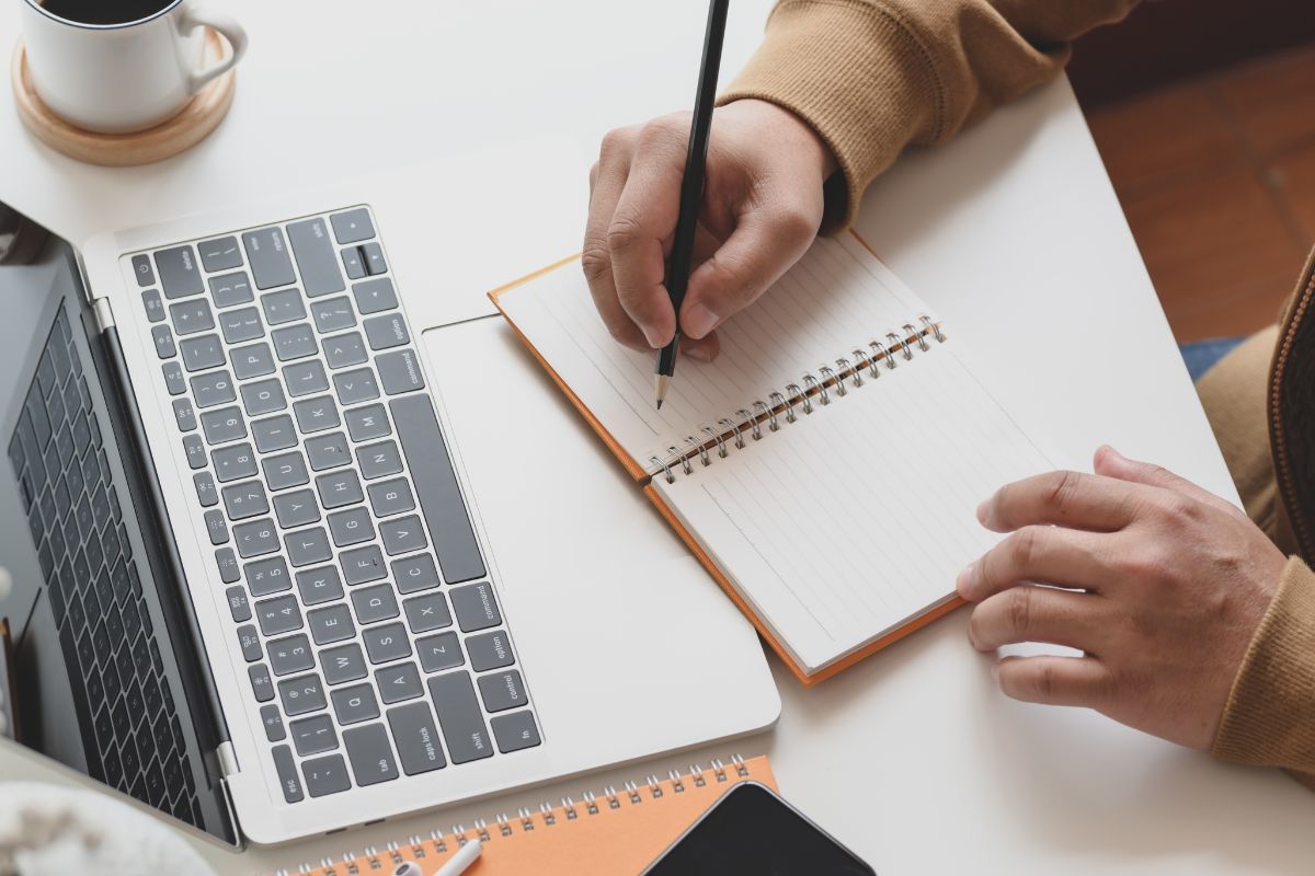 A picture of someone writing. 