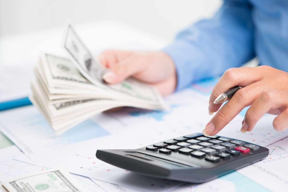 A picture of someone counting their money. 