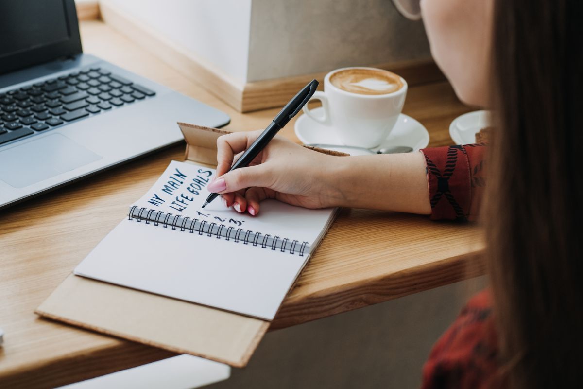 A picture of someone creating financial goals. 