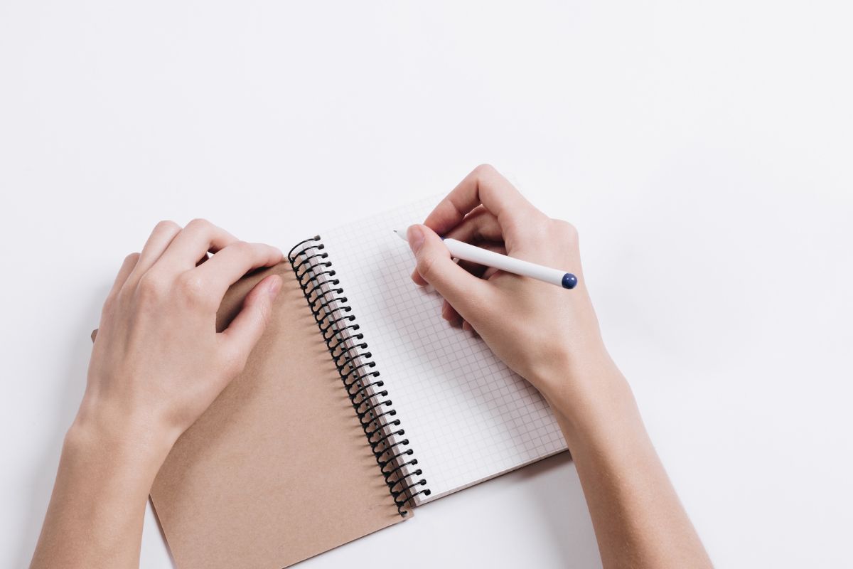 A picture of someone writing something. 