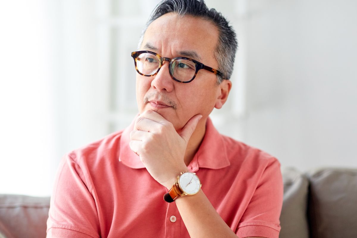 A picture of an old person thinking. 