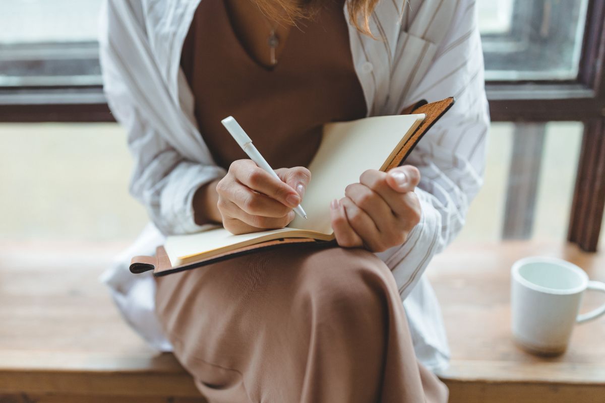 A picture of someone writing. 