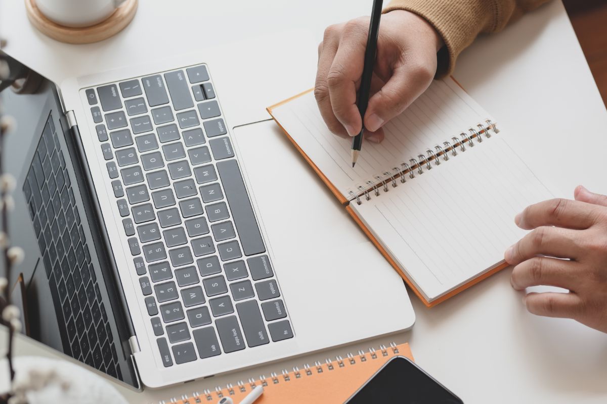A picture of someone writing. 