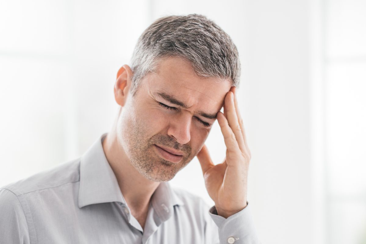 A picture of someone with a headache. 