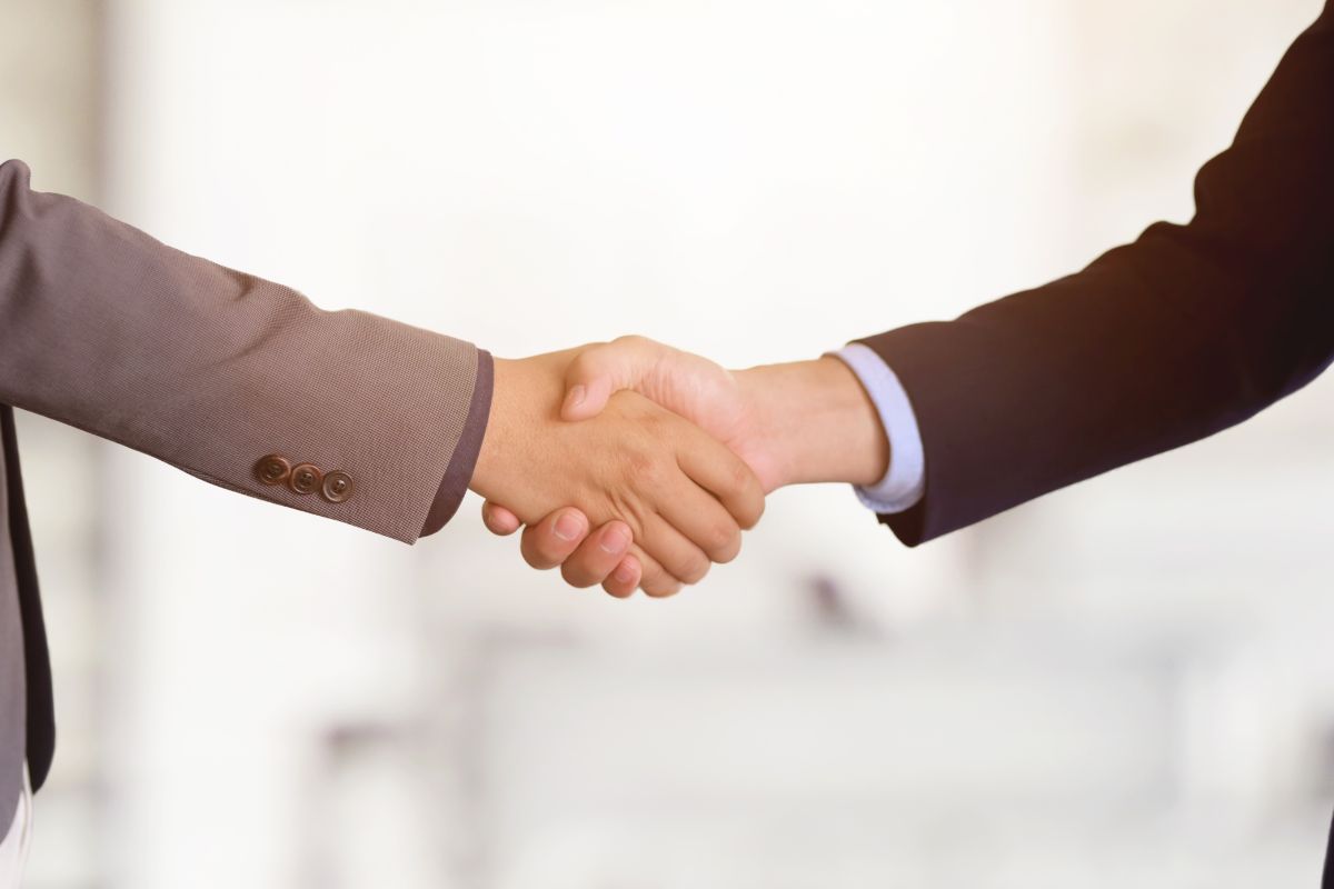 A picture of people shaking hands.