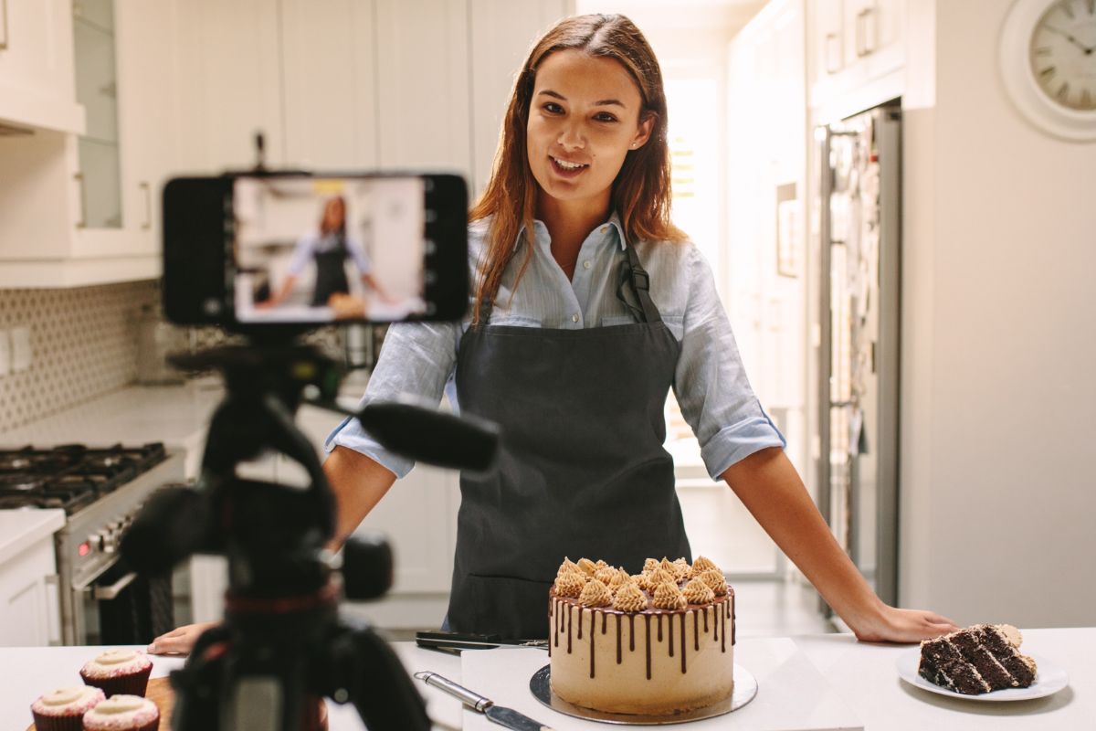 A picture of a baker recording herself. 