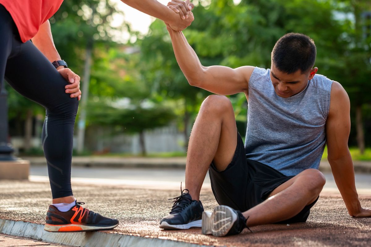 A picture of someone trying to get up.