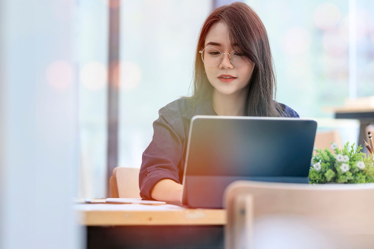A picture of a woman typing.