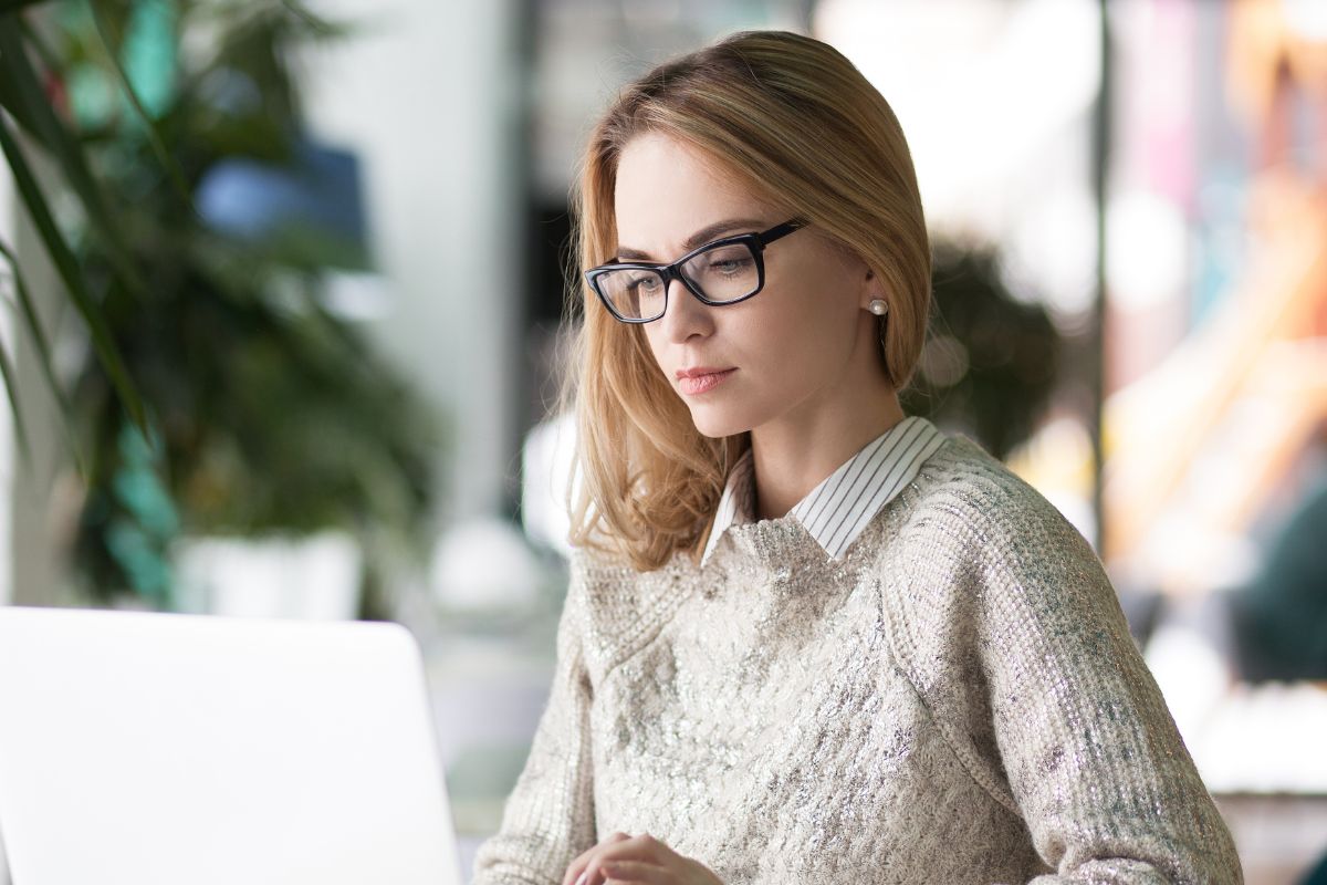 A picture of someone looking at their gadget.