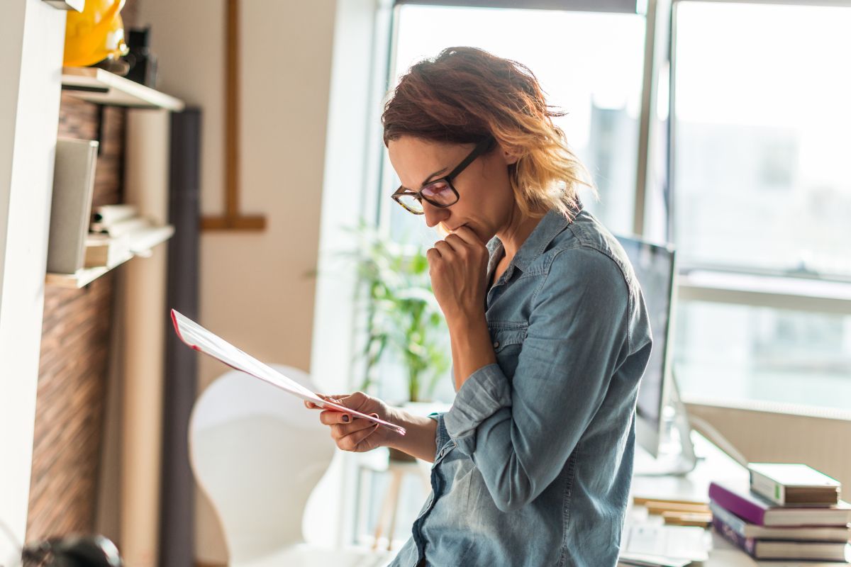 A picture of someone looking at papers.