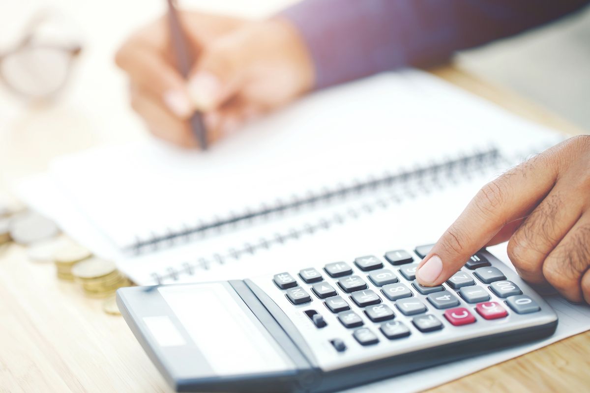 A picture of someone calculating something. 