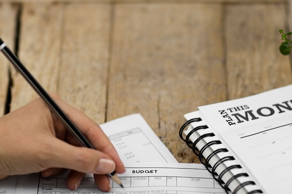 A picture of someone making a budget. 