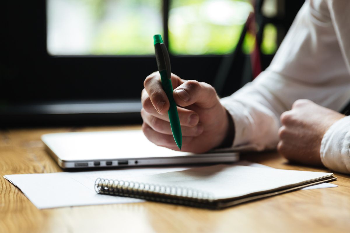 A picture of someone writing something. 