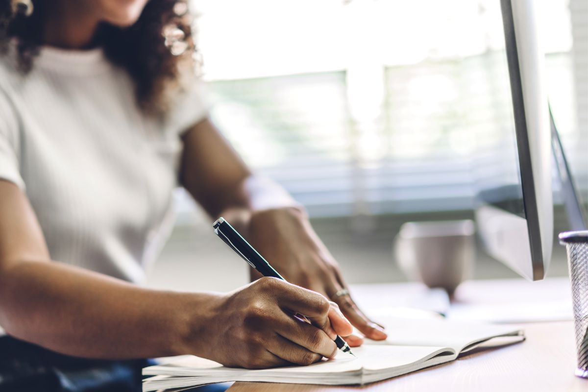 A picture of someone writing. 