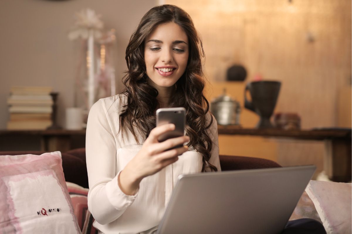 A picture of someone using her phone. 