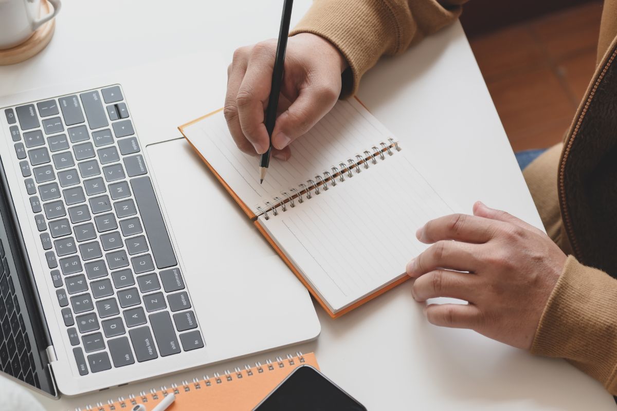 A picture of someone writing something. 