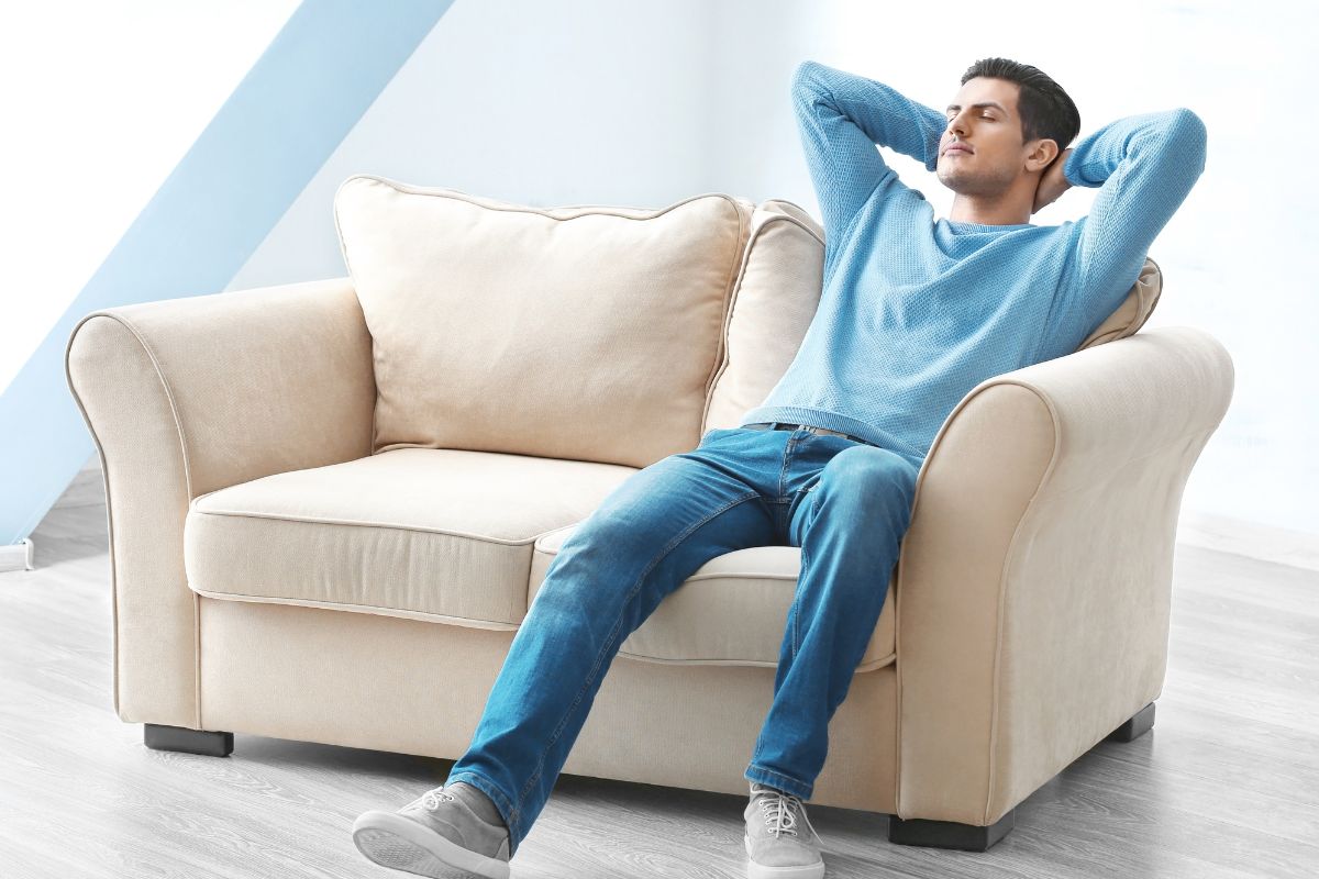 A picture of someone resting on their sofa. 