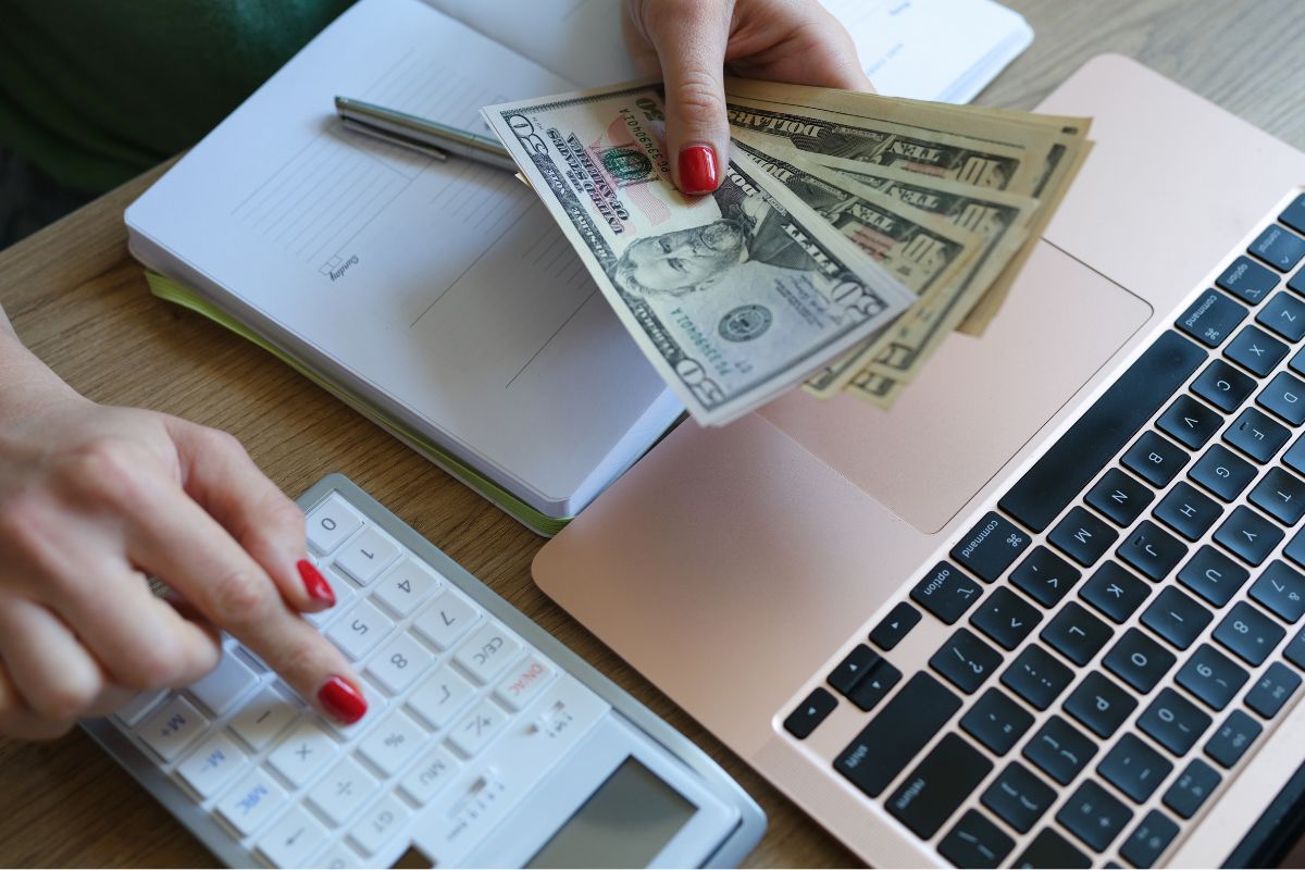 A picture of someone counting their money.
