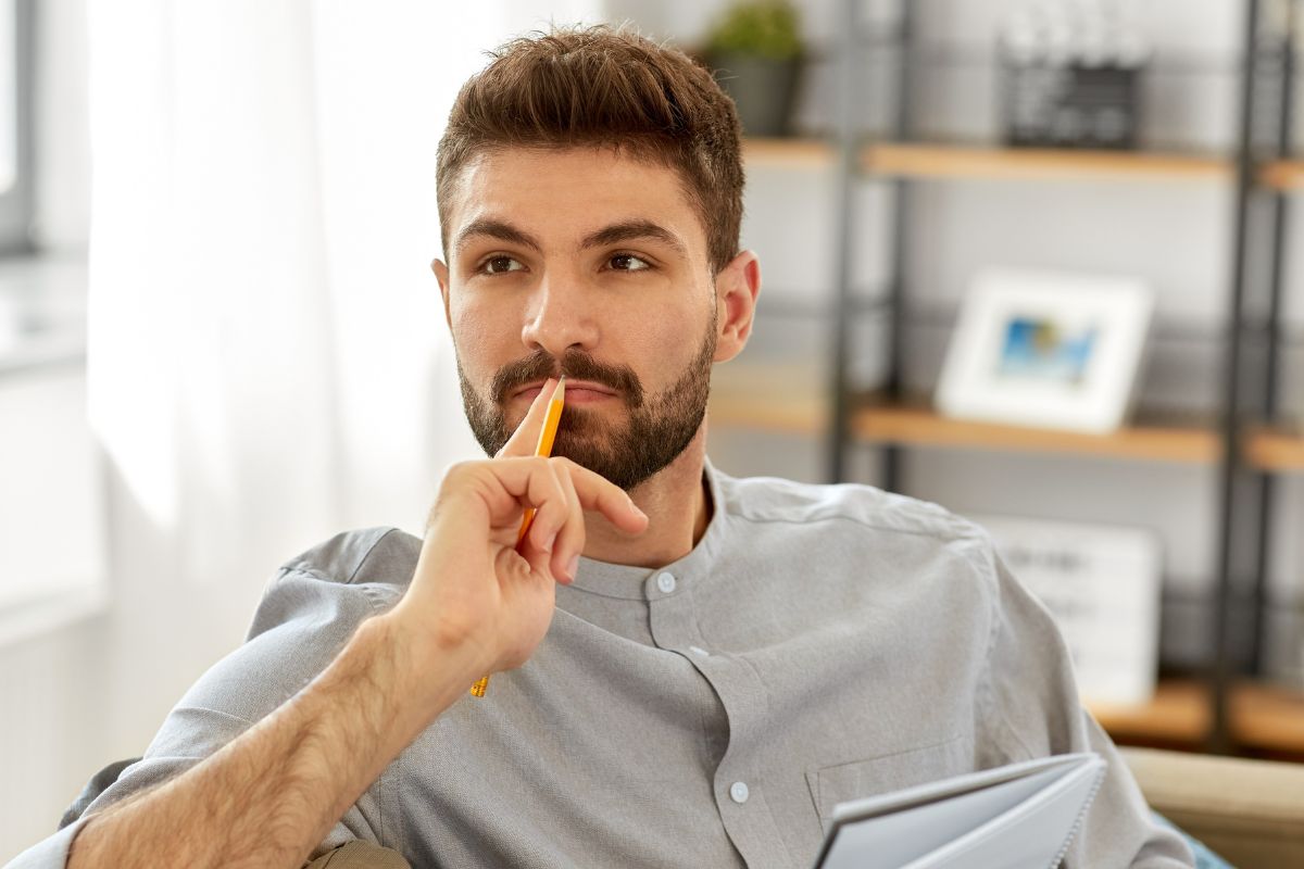 A picture of a man thinking.