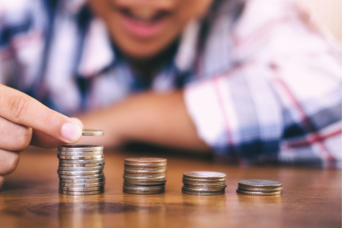 A picture of a kid saving up. 