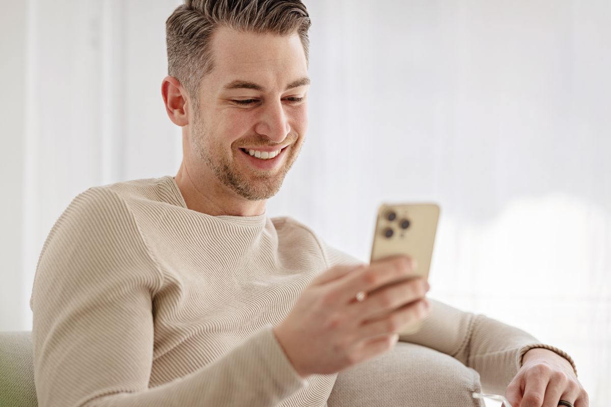 A picture of someone using a phone.