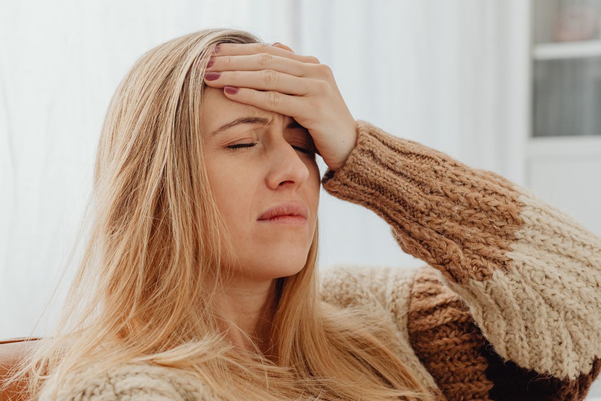 A picture of someone having a headache. 