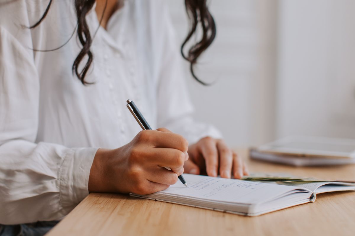 A picture of someone writing something. 