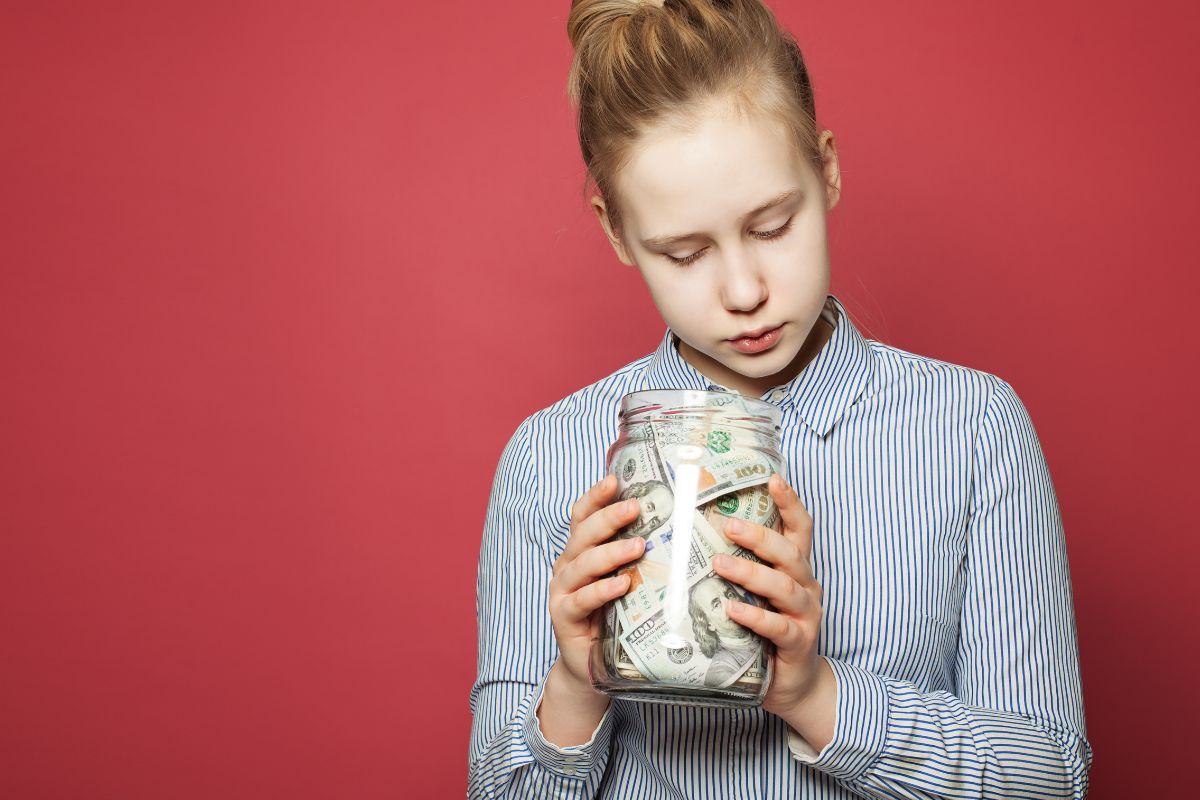 A picture of a teen saving up. 