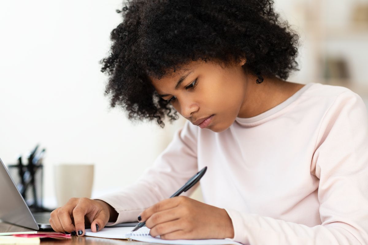 A picture of someone writing something. 